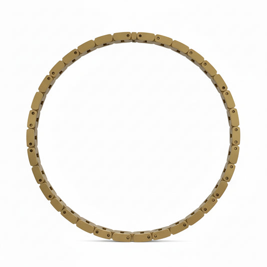 Gold bracelet on a wooden surface