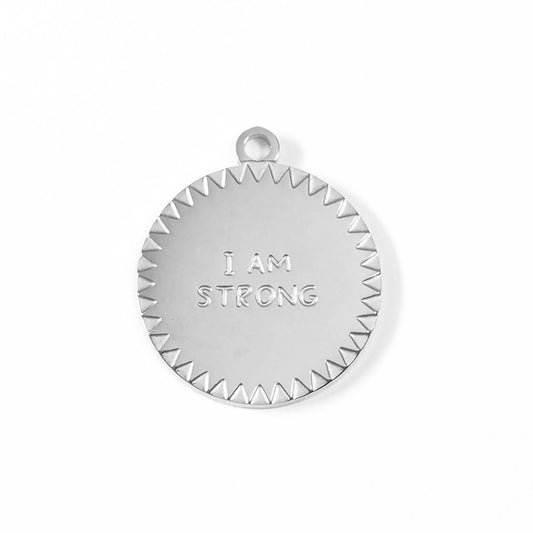 Silver pendant with 'I AM STRONG' engraving on a white background
