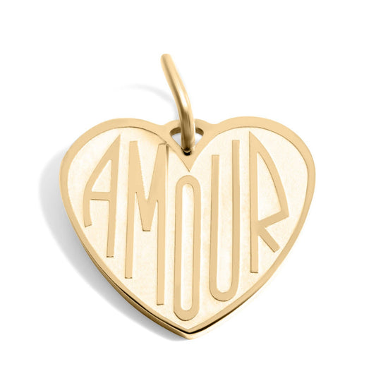 Gold heart-shaped pendant with 'AMOUR' engraving on a white background
