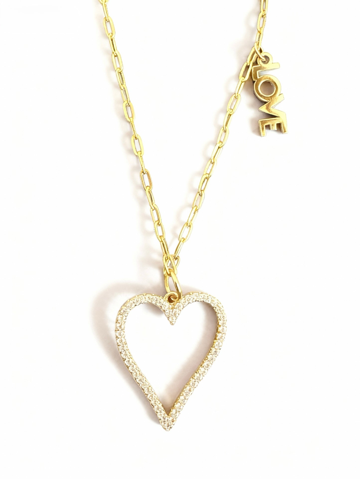 Gold heart-shaped pendant necklace on a white background