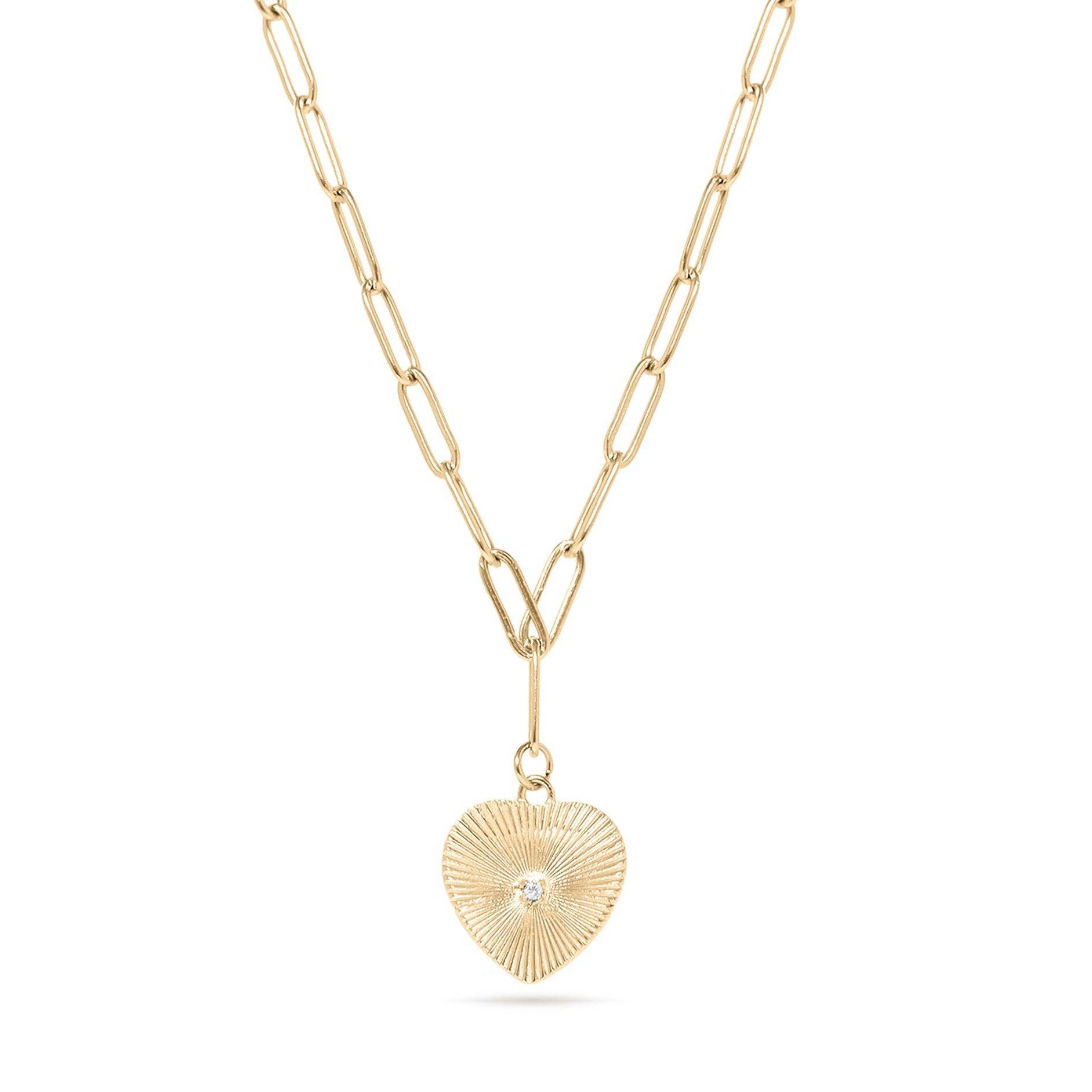 Gold necklace with a heart-shaped pendant on a white background