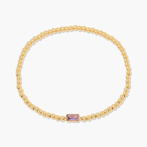 Gold bracelet with a purple gemstone on a white background