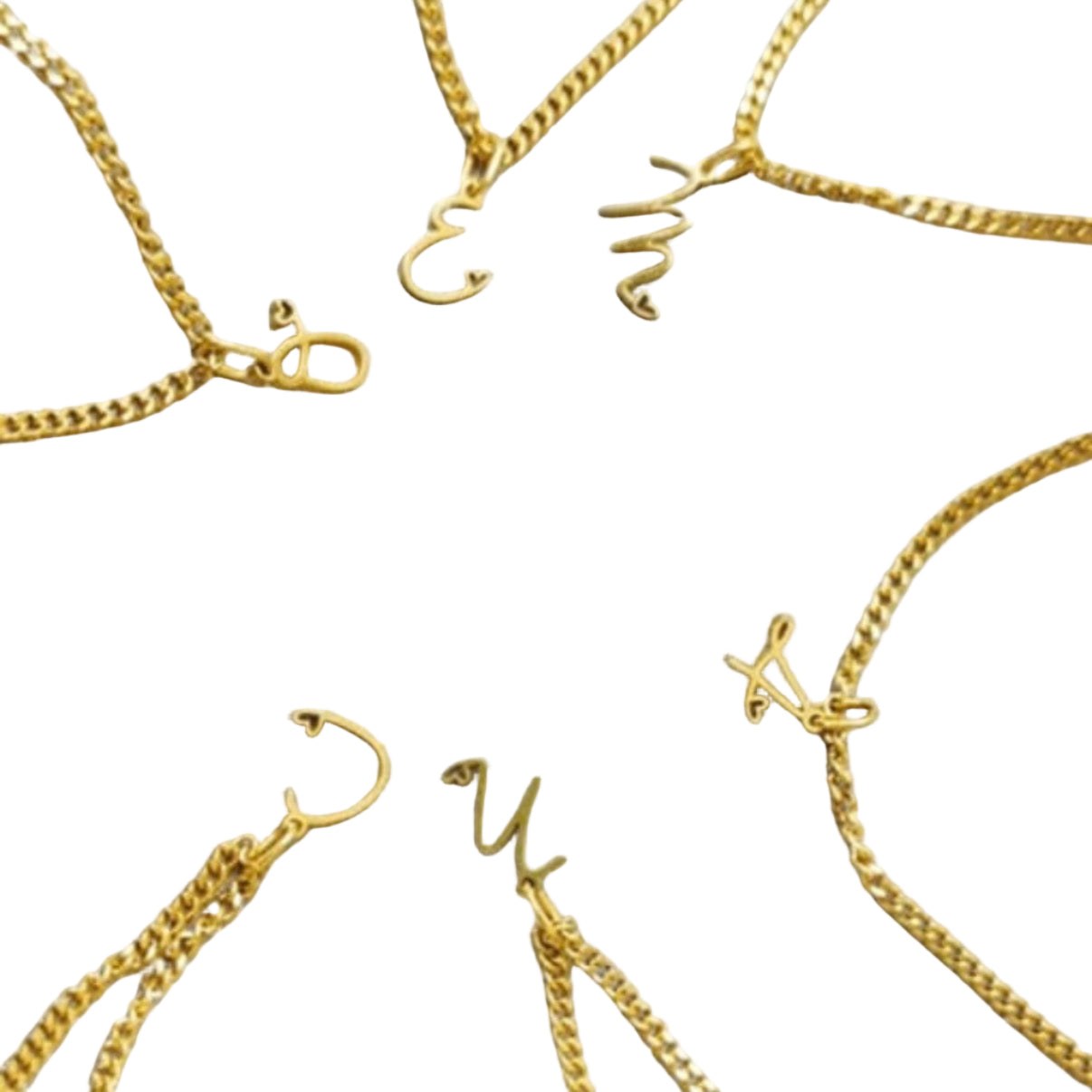 Gold necklaces with various designs on a white background