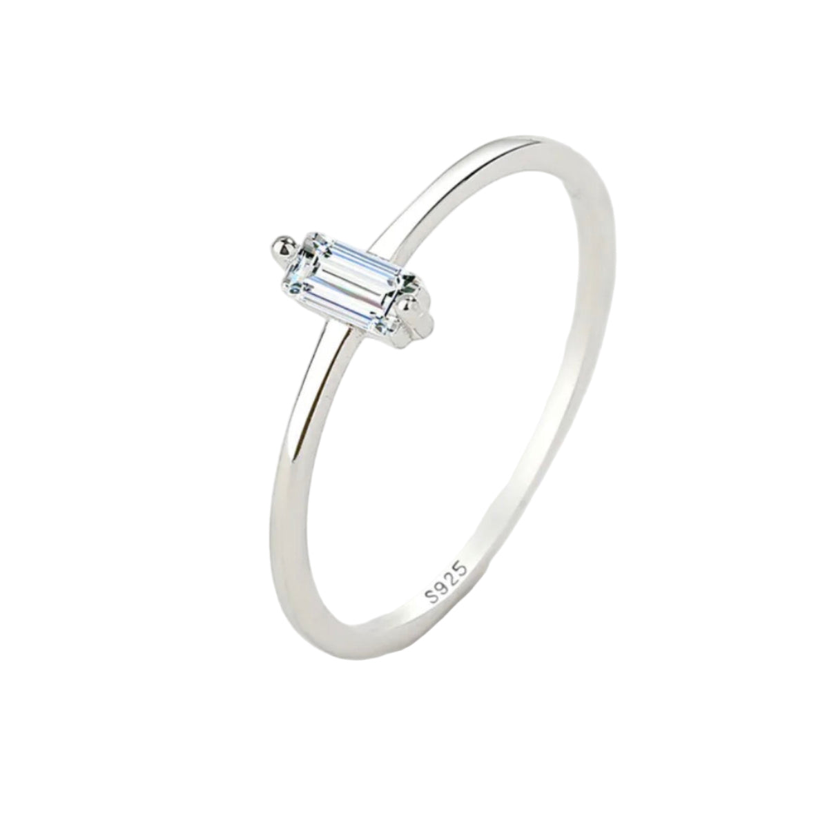 Silver ring with a baguette-cut gemstone on a light gray background