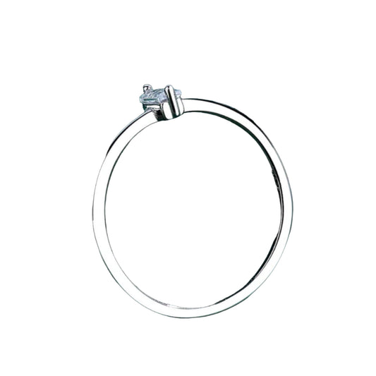 Silver ring with a diamond on a green fabric background