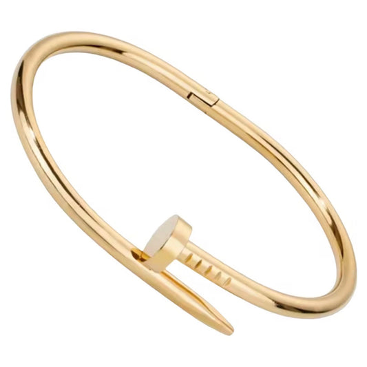 Gold bangle on a white background