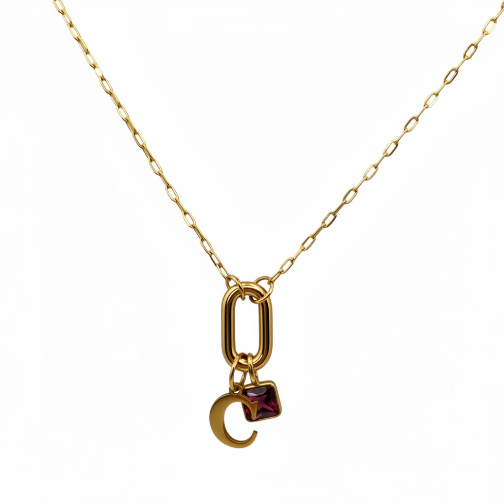 Gold necklace with a unique pendant on a white background