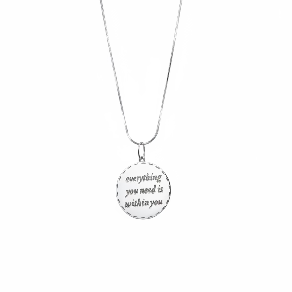 Necklace with a pendant that says 'everything you need is within you' on a white background