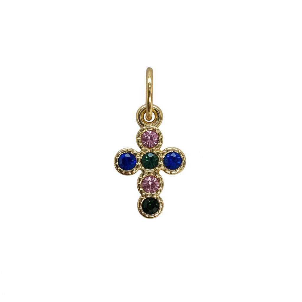 Gold cross pendant with multicolored gemstones on a white background
