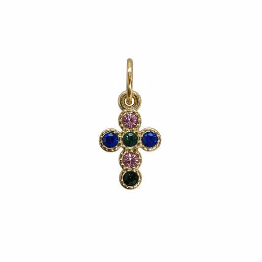 Gold cross pendant with multicolored gemstones on a white background