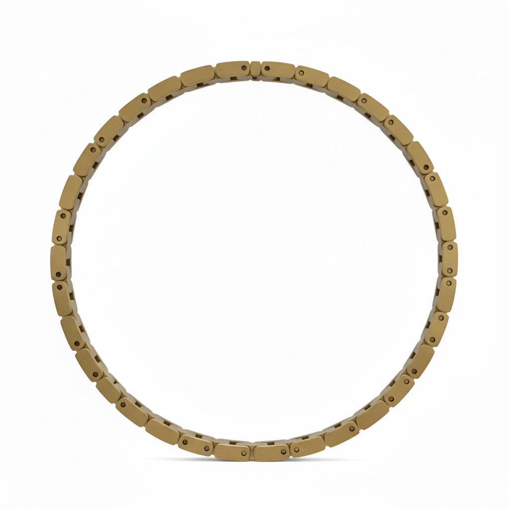 Gold bracelet on a wooden surface