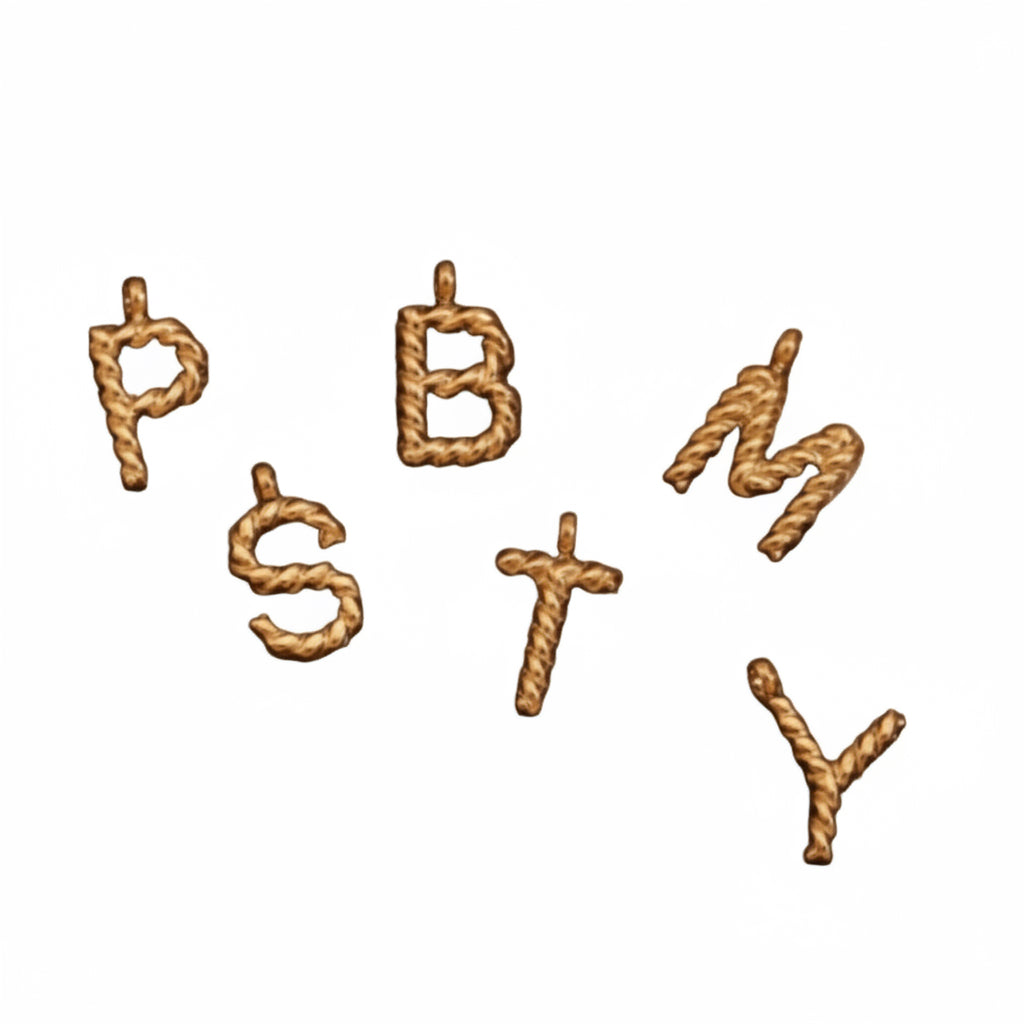 Gold letter pendants spelling 'P B M Y' on a textured surface