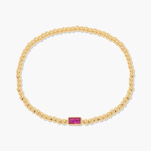 Gold bracelet with a pink gemstone on a white background