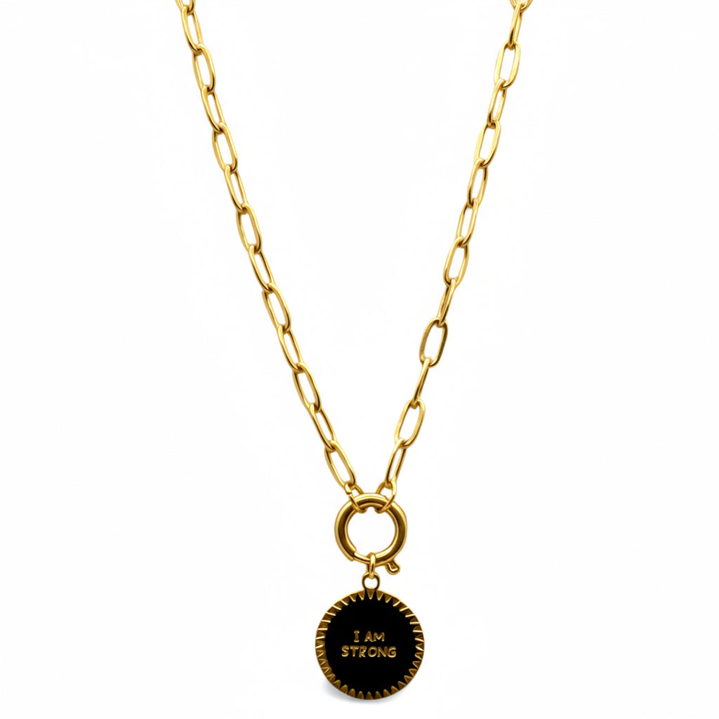 Necklace with a round pendant that says 'I AM STRONG' on a white background