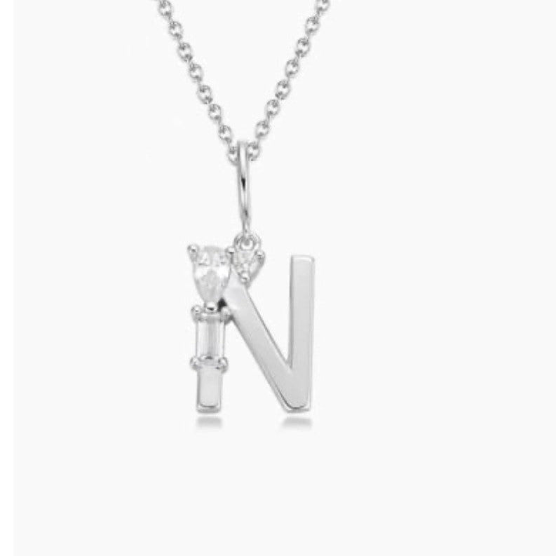 Silver necklace with a 'N' pendant on a white background