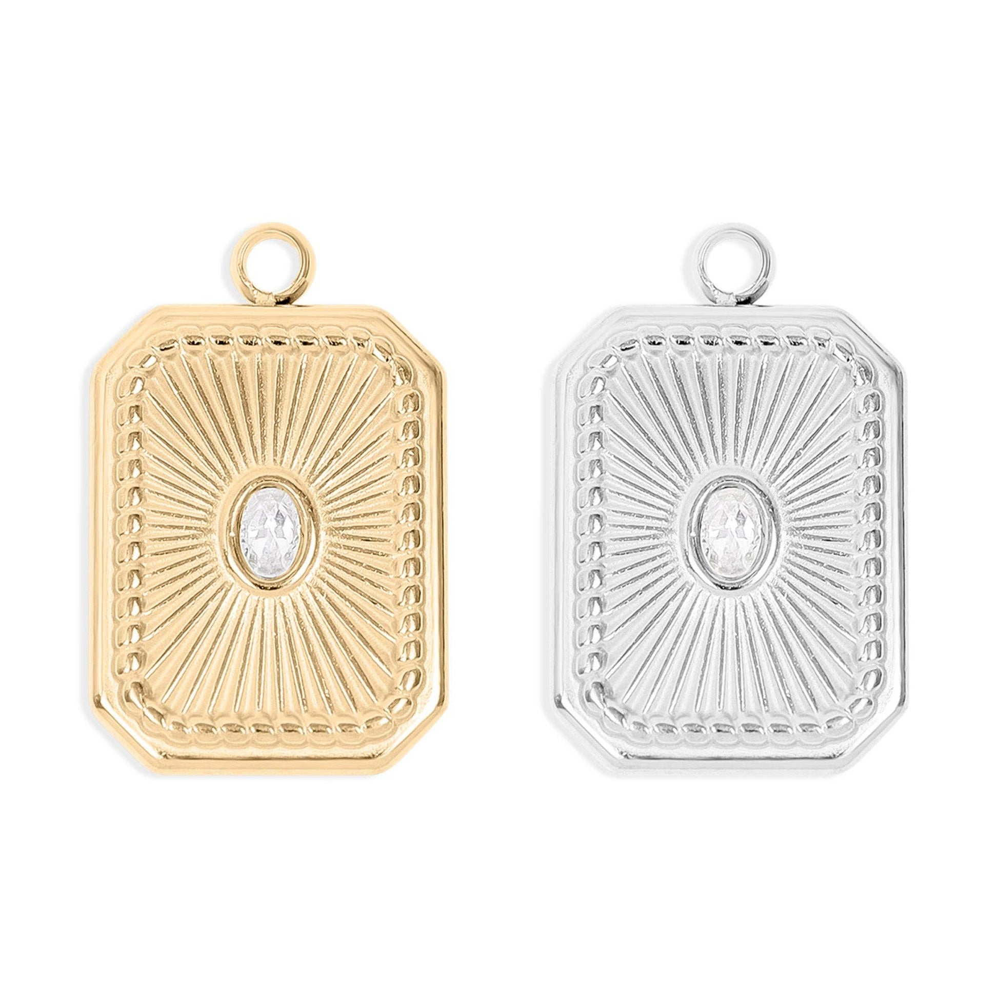 Gold and silver pendants with intricate designs on a white background
